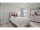 Bedroom featuring a window, neutral walls, carpet and dresser with mirror at 5329 Royal Point Ave, Kissimmee, FL 34746