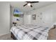 Bright bedroom with a ceiling fan, carpeted floor, and a wall-mounted television at 5329 Royal Point Ave, Kissimmee, FL 34746