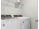 Modern laundry room featuring a Whirlpool washer and dryer set at 5329 Royal Point Ave, Kissimmee, FL 34746