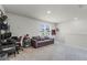 Bright upstairs living room with neutral carpet, gray couch, and an abundance of natural light at 5329 Royal Point Ave, Kissimmee, FL 34746