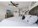 Bright main bedroom featuring a ceiling fan, television, and neutral color palette at 5329 Royal Point Ave, Kissimmee, FL 34746