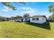 Large backyard with mature landscaping, offering ample space and privacy at 5402 Kingswood Dr, Orlando, FL 32810