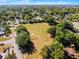 Aerial view of neighborhood park field with trees and playground in a residential area at 5402 Kingswood Dr, Orlando, FL 32810