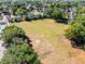 Aerial view of neighborhood park field with trees and playground, perfect for recreation at 5402 Kingswood Dr, Orlando, FL 32810