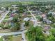 Aerial view of a residential neighborhood, showcasing well-maintained homes and tree-lined streets at 549 Mcneal Dr, Deltona, FL 32725
