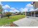 Spacious backyard with a concrete patio, green lawn, and fenced perimeter at 549 Mcneal Dr, Deltona, FL 32725