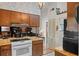 Bright kitchen with sleek countertops, modern appliances, and a peek into the living area at 549 Mcneal Dr, Deltona, FL 32725