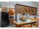 Bright kitchen featuring sleek countertops, modern appliances, and a cozy breakfast bar at 549 Mcneal Dr, Deltona, FL 32725
