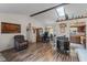 The living room features an open layout with wood-look floors, skylight, and dining area, perfect for entertaining at 549 Mcneal Dr, Deltona, FL 32725