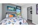 bedroom with playful decor and a comfortable bed with fun themed bedding. Ample closet space at 5663 Loggia Ln, Kissimmee, FL 34758