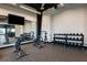 A well-appointed gym featuring weight racks, benches, and a mirror for a complete fitness experience at 5663 Loggia Ln, Kissimmee, FL 34758