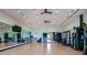 Spacious gym with mirrored walls, weight training equipment, and a bright, open atmosphere for fitness enthusiasts at 5663 Loggia Ln, Kissimmee, FL 34758