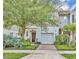 Charming townhome with inviting front porch and lush landscaping at 58 Zamora Pl, Oviedo, FL 32765