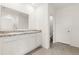 Bright bathroom featuring double vanity with granite countertop and tiled floors at 715 Chinoy Rd, Davenport, FL 33837