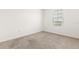 This bedroom features neutral walls and beige carpeting at 715 Chinoy Rd, Davenport, FL 33837