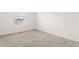 This bedroom features neutral walls and beige carpeting at 715 Chinoy Rd, Davenport, FL 33837