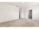 Spacious carpeted bedroom featuring neutral walls, natural light, and multiple doorways leading to other rooms at 715 Chinoy Rd, Davenport, FL 33837