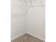 Walk-in closet with wire shelving and beige carpeting at 715 Chinoy Rd, Davenport, FL 33837