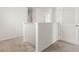 Upstairs hallway featuring white walls, carpet flooring, white banisters, and access to bedrooms at 715 Chinoy Rd, Davenport, FL 33837
