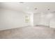 Bright and airy living room with neutral carpet, white walls, and abundant natural light from a large window at 715 Chinoy Rd, Davenport, FL 33837