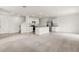 Spacious open-concept living area, featuring a kitchen with stainless steel appliances and carpeted living space at 715 Chinoy Rd, Davenport, FL 33837