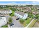 Aerial view of townhomes, landscaping and surrounding neighborhood at 7772 Sweet Star Avenue, Orlando, FL 32836