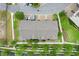 Aerial of modern townhouse complex featuring private parking and beautiful green landscaping at 7772 Sweet Star Avenue, Orlando, FL 32836