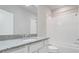 Modern bathroom showcases a granite countertop, sleek fixtures, and a tiled shower/tub combo at 7772 Sweet Star Avenue, Orlando, FL 32836