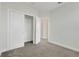 Neutral bedroom featuring carpet floors, closet with open doors, and white walls at 7772 Sweet Star Avenue, Orlando, FL 32836