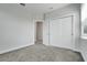 Bedroom with plush carpet, closet and doorway leading to other rooms at 7772 Sweet Star Avenue, Orlando, FL 32836