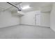 Spacious garage with epoxy flooring, overhead storage and room for two cars at 7772 Sweet Star Avenue, Orlando, FL 32836