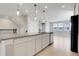 Spacious kitchen with an island, granite countertops, and modern stainless steel appliances at 7772 Sweet Star Avenue, Orlando, FL 32836