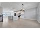 Modern kitchen featuring white cabinets, granite countertops, and stainless steel appliances at 7772 Sweet Star Avenue, Orlando, FL 32836