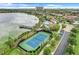 Stay active with a well-maintained tennis court, complete with waterfront views and lush landscaping at 7772 Sweet Star Avenue, Orlando, FL 32836