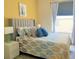 Comfortable bedroom with a large window, stylish bedding, and a coordinated color scheme at 8023 King Palm Cir, Kissimmee, FL 34747