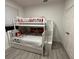 bedroom with a bunk bed set, gray and red Mickey Mouse bedding, and stair access at 8023 King Palm Cir, Kissimmee, FL 34747