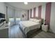 Comfortable bedroom with stylish decor, neutral walls, and lots of natural light at 8023 King Palm Cir, Kissimmee, FL 34747