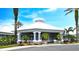 Community clubhouse featuring a covered entrance, well-maintained landscaping, and welcoming architecture at 8023 King Palm Cir, Kissimmee, FL 34747