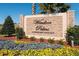 Windsor Palms gated resort community entrance with stone signage and vibrant landscaping at 8023 King Palm Cir, Kissimmee, FL 34747