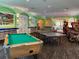 Large game room featuring a pool table, ping pong table, and arcade games at 8023 King Palm Cir, Kissimmee, FL 34747