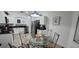 Open-concept kitchen and dining area with white cabinetry and natural lighting at 8023 King Palm Cir, Kissimmee, FL 34747
