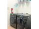 The laundry room features a modern Samsung washer and dryer set, shelf space, and a fire extinguisher at 8023 King Palm Cir, Kissimmee, FL 34747