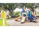 A playground featuring slides and climbing structures for outdoor fun and recreation at 8023 King Palm Cir, Kissimmee, FL 34747
