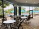 Screened-in lanai provides shade for poolside tables and lounge chairs at 8023 King Palm Cir, Kissimmee, FL 34747