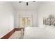 Bedroom with hardwood floors, ceiling fan, and sliding doors to backyard at 836 Copperfield Ter, Casselberry, FL 32707