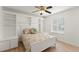 Cozy bedroom with built-in shelving and ample storage space, complemented by natural light from the window at 836 Copperfield Ter, Casselberry, FL 32707