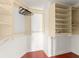 Walk-in closet with custom shelving and wood flooring, perfect for organizing your wardrobe at 836 Copperfield Ter, Casselberry, FL 32707