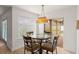 Cozy dining area with a chandelier, large window and sliding glass door leading to the patio at 836 Copperfield Ter, Casselberry, FL 32707