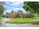 Charming home featuring a well-manicured lawn, tile roof, and mature landscaping, with a two car garage at 836 Copperfield Ter, Casselberry, FL 32707