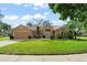 Charming single-story home with a well-manicured lawn and beautiful landscaping at 836 Copperfield Ter, Casselberry, FL 32707